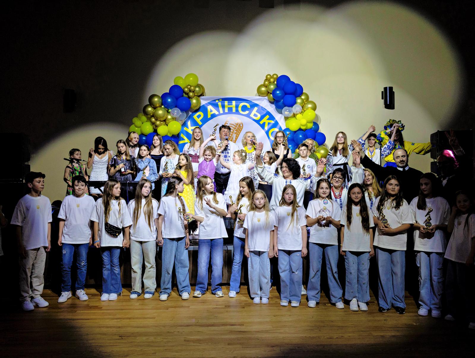 Winners and participants gathered on stage at the Voice of the Ukrainian Diaspora contest
